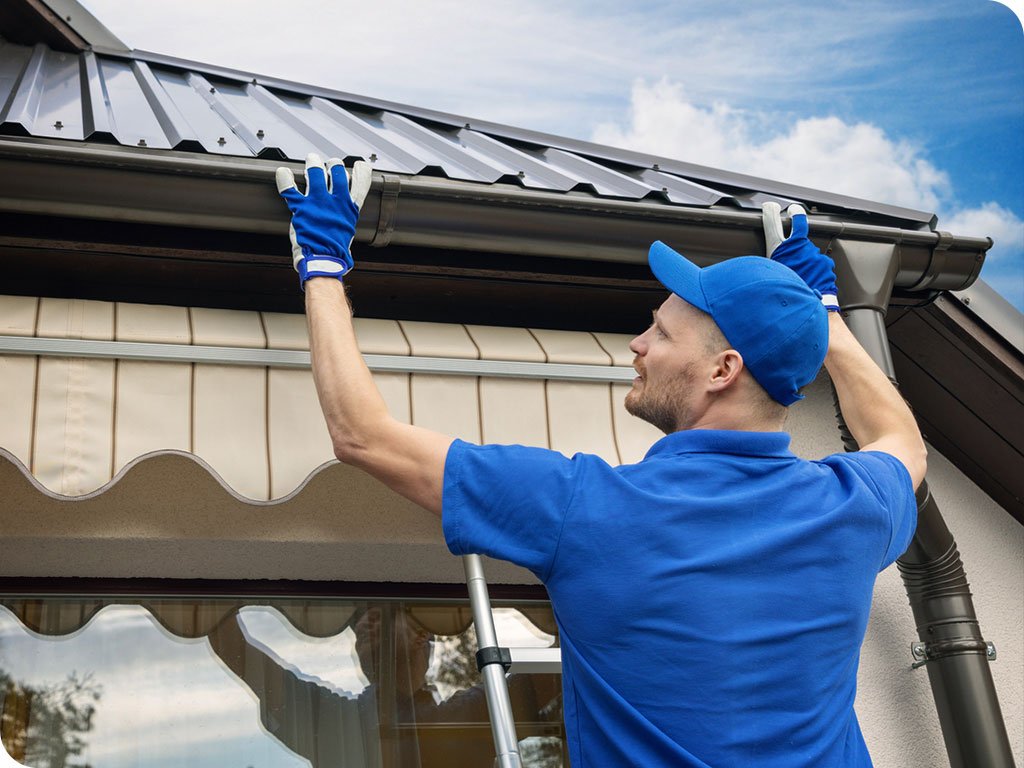 Certified Gutter Technician from Rocket Estate Builders installing Gutters in Central Florida