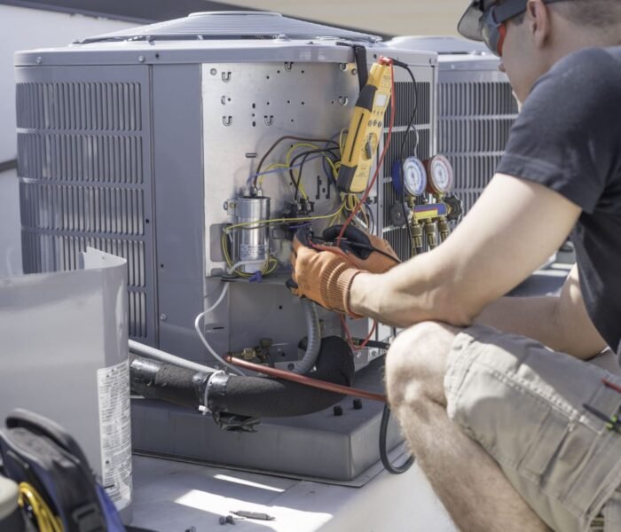 Rocket Estate Builders HVAC technician testing the system