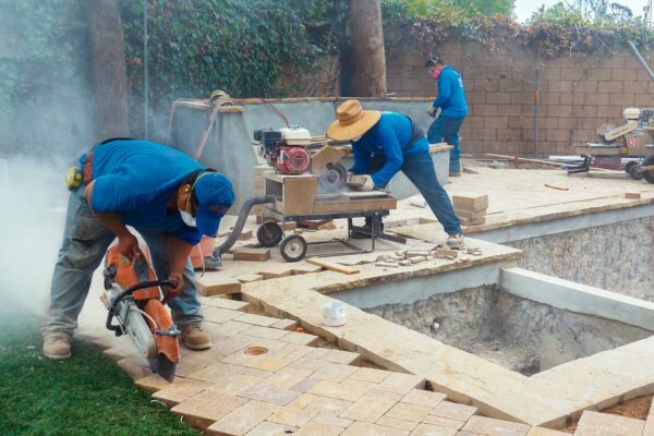 Certified Pavers from Rocket Estate Builders renovating a backyard pool area in Central Florida